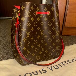 Louis Vuitton bag lightly used, has been covered and stored.